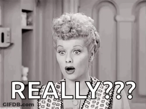 A Black And White Photo Of A Woman Making A Surprised Face And The Words `` Really '' . GIF