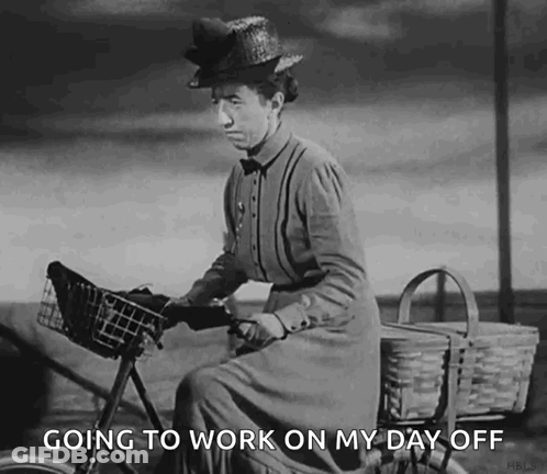 A Black And White Photo Of A Woman Riding A Bicycle With The Words `` Going To Work On My Day Off '' Below Her . GIF
