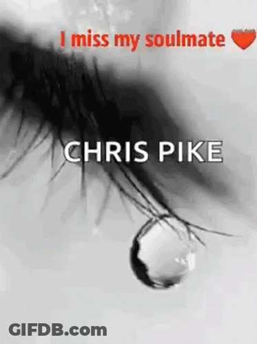 A Black And White Photo Of A Woman 'S Eye With A Tear Drop . GIF