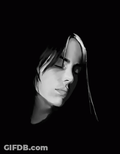 A Black And White Photo Of A Woman 'S Face With Her Eyes Closed GIF