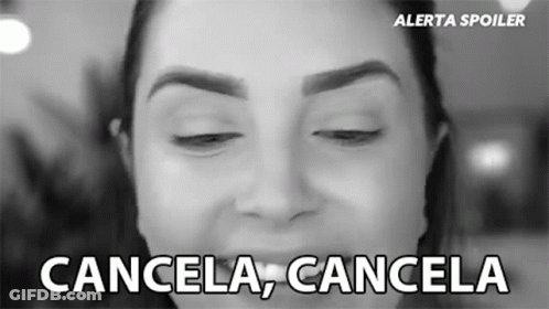 A Black And White Photo Of A Woman 'S Face With The Words Cancela Cancela Below It GIF