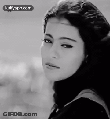 A Black And White Photo Of A Woman 'S Face With The Words Kulfyapp.com At The Bottom GIF