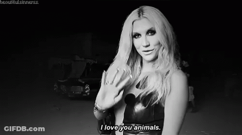 A Black And White Photo Of A Woman Saying `` I Love You Animals '' . GIF