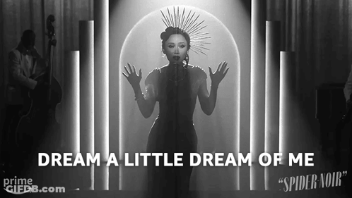 A Black And White Photo Of A Woman Singing With The Words " Dream A Little Dream Of Me " Below Her GIF