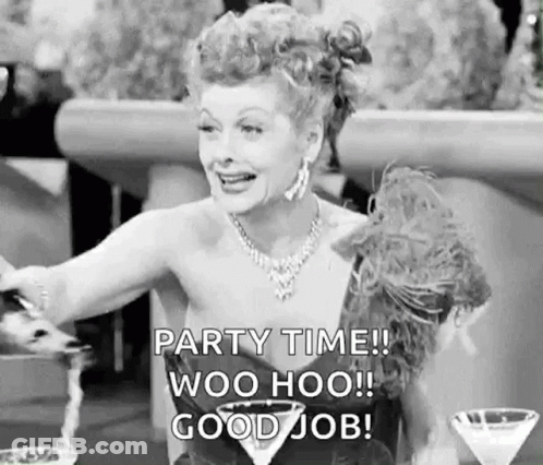 A Black And White Photo Of A Woman Sitting At A Table With A Martini Glass And A Bottle Of Champagne . GIF