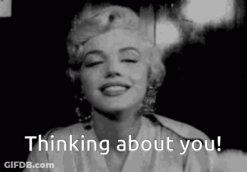 A Black And White Photo Of A Woman Smiling With The Words `` Thinking About You '' Written Below Her . GIF