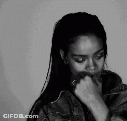 A Black And White Photo Of A Woman Smoking A Cigarette . GIF