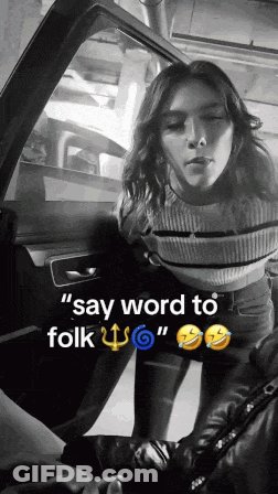 A Black And White Photo Of A Woman Standing In A Car With The Caption Say Word To Folk GIF