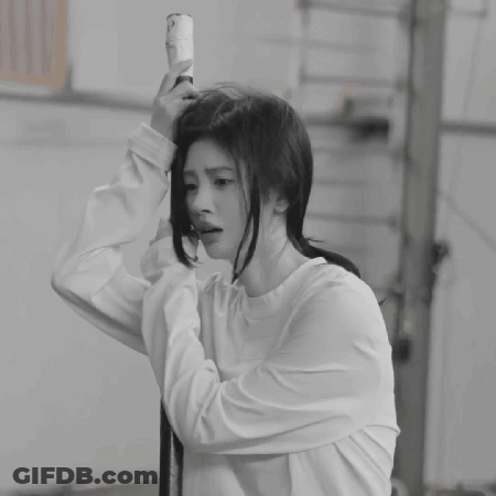 A Black And White Photo Of A Woman Taking A Selfie GIF