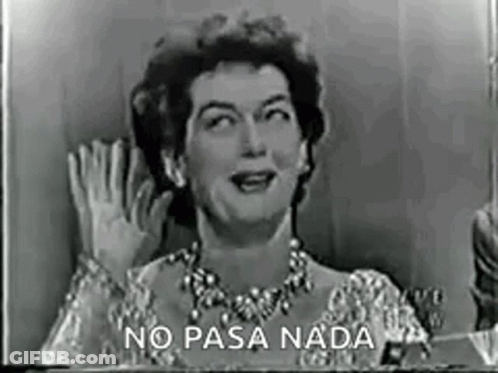A Black And White Photo Of A Woman Waving Her Hand In A Foreign Language . GIF