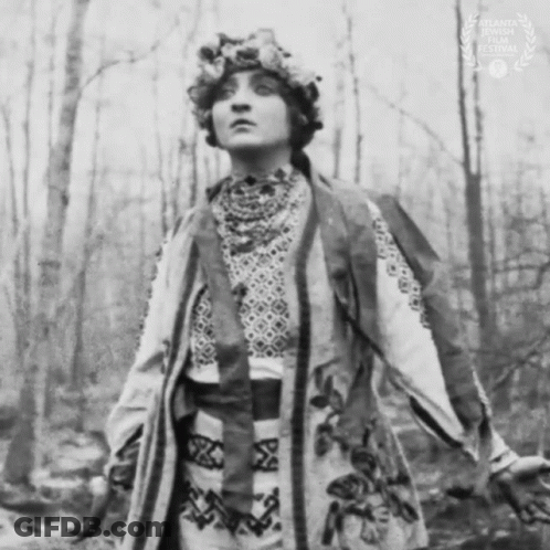 Black And White Photo Of Woman With Floral Hat GIF