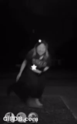 A Black And White Photo Of A Woman Wearing Headphones And A Headband . GIF