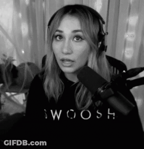 A Black And White Photo Of A Woman Wearing Headphones And A Sweatshirt With The Word Swoosh On It . GIF