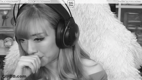 A Black And White Photo Of A Woman Wearing Headphones With The Words Stella Chuu On The Bottom Right GIF