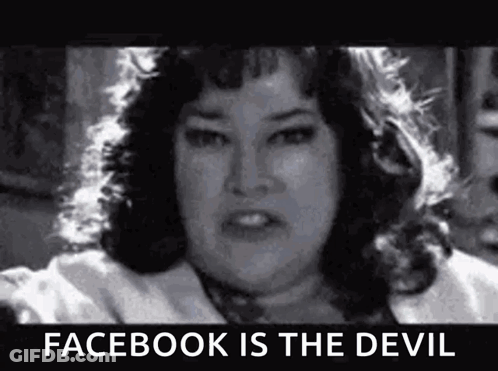 A Black And White Photo Of A Woman With A Caption That Says `` Facebook Is The Devil '' . GIF