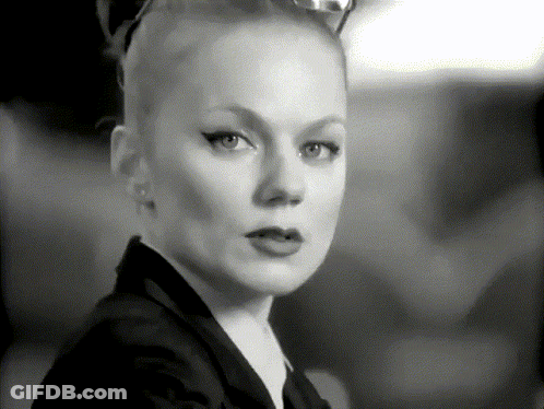 A Black And White Photo Of A Woman With A Cat Ear GIF
