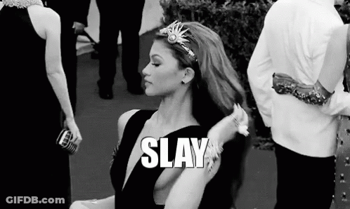 A Black And White Photo Of A Woman With A Crown On Her Head And The Words `` Slay '' Written Above Her . GIF