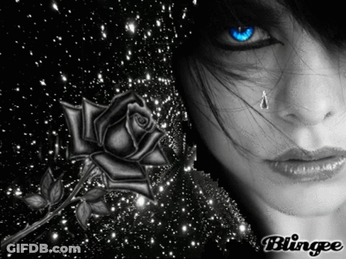 A Black And White Photo Of A Woman With A Rose And A Tear Coming Out Of Her Eye GIF