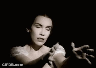 A Black And White Photo Of A Woman With A Surprised Expression On Her Face . GIF