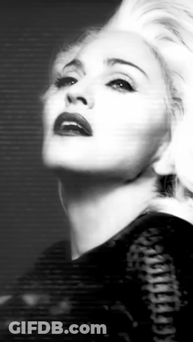 A Black And White Photo Of A Woman With Blonde Hair And Red Lips . GIF