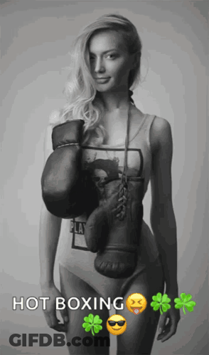 A Black And White Photo Of A Woman With Boxing Gloves And The Words Hot Boxing Below Her GIF