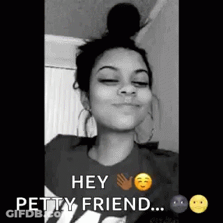 A Black And White Photo Of A Woman With Her Eyes Closed And A Bun On Her Head . GIF