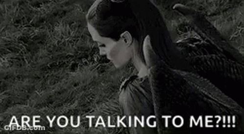 A Black And White Photo Of A Woman With Horns And The Words `` Are You Talking To Me '' . GIF