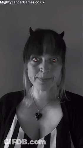 A Black And White Photo Of A Woman With Horns And The Words Mightylancergames.co.uk At The Bottom GIF
