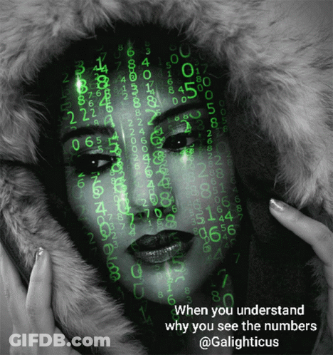 A Black And White Photo Of A Woman With Numbers On Her Face GIF