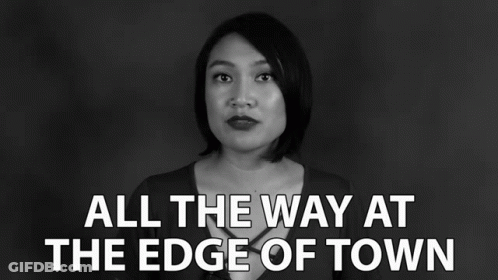 A Black And White Photo Of A Woman With The Words " All The Way At The Edge Of Town " GIF