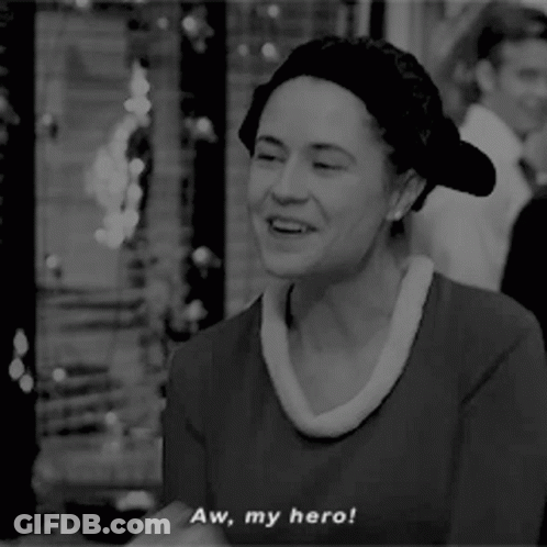 A Black And White Photo Of A Woman With The Words Aw My Hero GIF