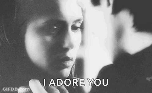 A Black And White Photo Of A Woman With The Words `` I Adore You '' Written Next To Her . GIF