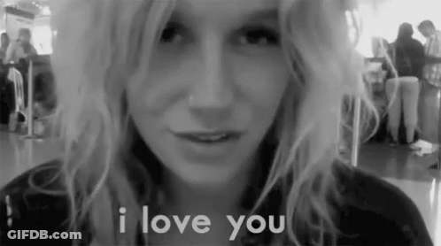 A Black And White Photo Of A Woman With The Words I Love You Behind Her GIF