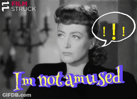 A Black And White Photo Of A Woman With The Words I 'M Not Amused Above Her GIF