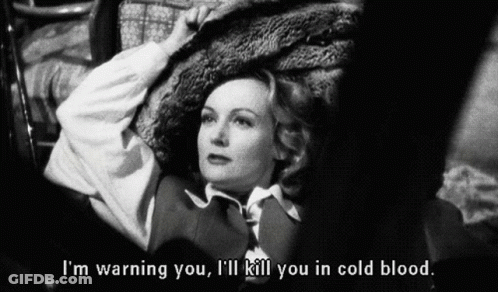 A Black And White Photo Of A Woman With The Words I 'M Warning You I 'Ll Kill You In Cold Blood Below Her GIF