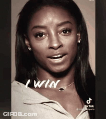 A Black And White Photo Of A Woman With The Words " I Win " Written On Her Neck GIF