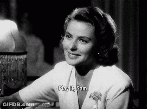 A Black And White Photo Of A Woman With The Words Play It Sam Above Her GIF