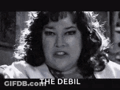 A Black And White Photo Of A Woman With The Words `` The Debil '' On The Bottom . GIF