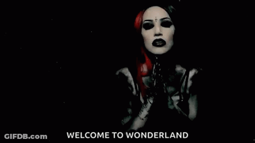 A Black And White Photo Of A Woman With The Words Welcome To Wonderland Behind Her GIF
