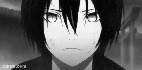 A Black And White Photo Of A Young Boy With Long Black Hair And Big Eyes . GIF