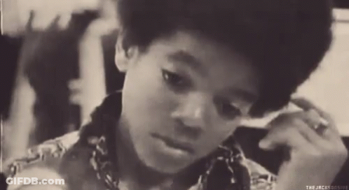 A Black And White Photo Of A Young Boy With The Words " The Jacksonsogive " On The Bottom Right GIF