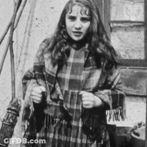 Black And White Photo Of Girl With Plaid Scarf GIF