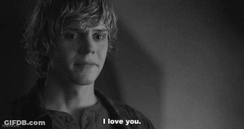A Black And White Photo Of A Young Man Saying " I Love You " GIF