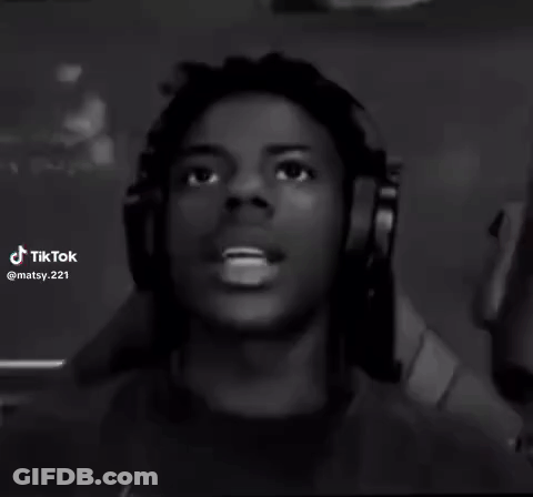 A Black And White Photo Of A Young Man Wearing Headphones And Looking Up . GIF