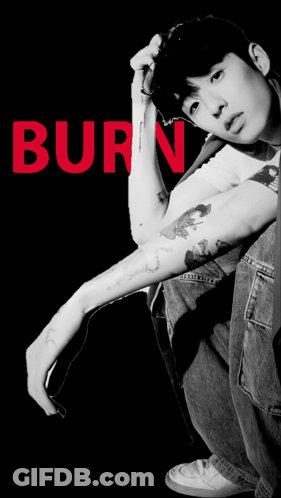 A Black And White Photo Of A Young Man With The Word Baby Written In Red GIF
