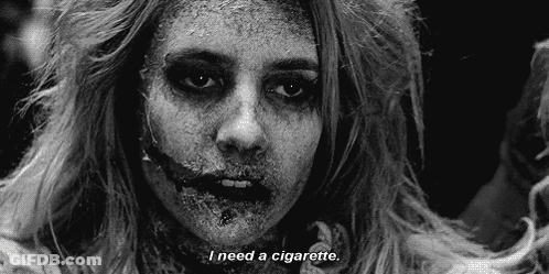 A Black And White Photo Of A Zombie With The Words `` I Need A Cigarette '' . GIF