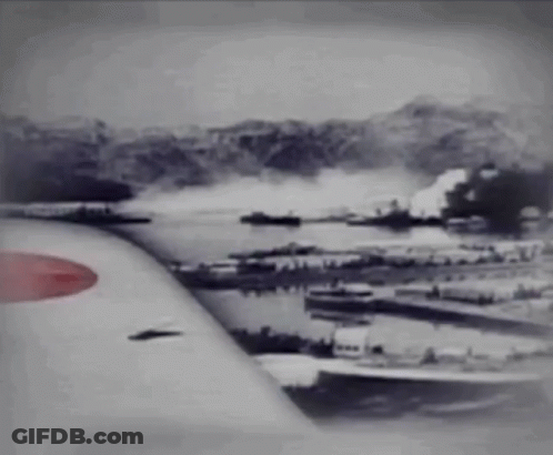 A Black And White Photo Of An Airplane Wing With A Red Circle On It GIF