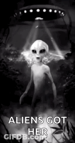 A Black And White Photo Of An Alien Standing In Front Of A Flying Saucer . GIF