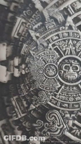 A Black And White Photo Of An Ancient Mexican Calendar . GIF