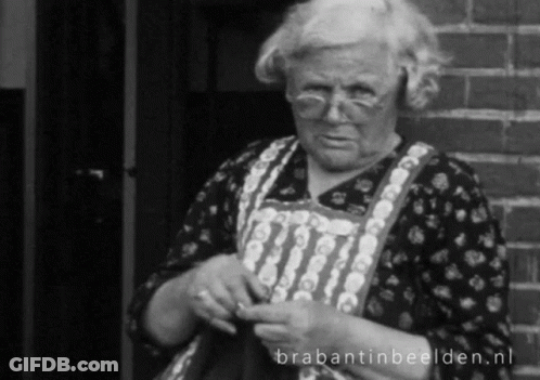 A Black And White Photo Of An Elderly Woman Knitting With Brabantinbeelden.nl Written On The Bottom GIF